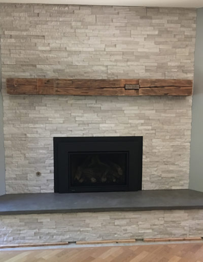Black Concrete Hearth with Stone Fireplace (1)